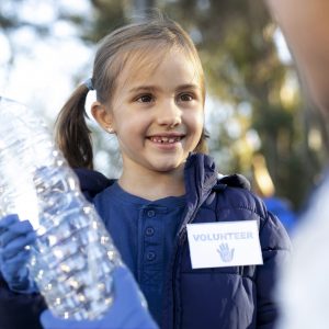 close up girl holding plastic bottle
